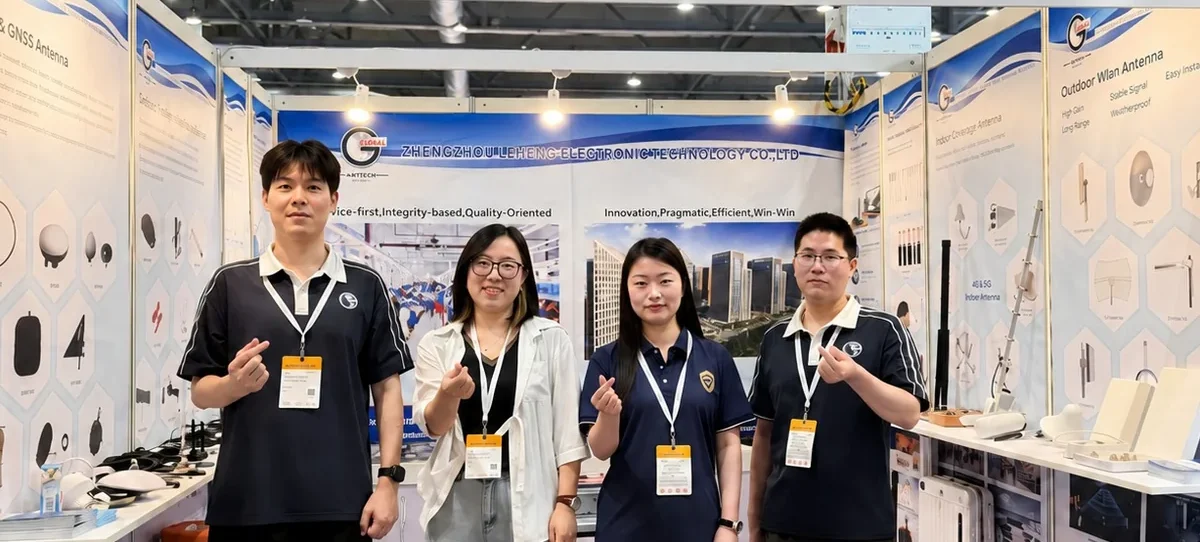Global RF Tech booth team at Global Sources Hong Kong 2026 with GPS, GNSS, WiFi and outdoor antenna displays.